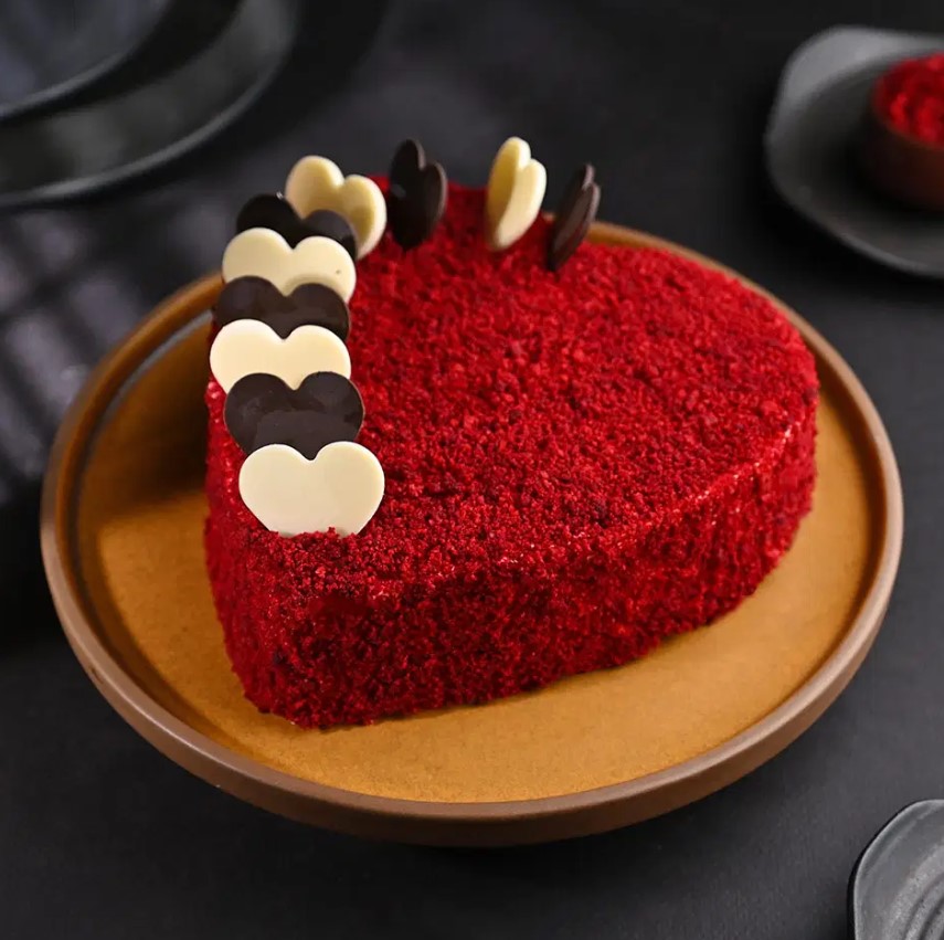 Screenshot 2024-11-14 153057 Beautiful Red Velvet Heart Cake with creamy white frosting and a soft, velvety texture