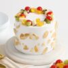 Fresh Fruit Cream Cake topped with vibrant, seasonal fruits and creamy frosting, perfect for special occasions