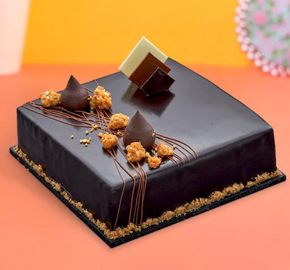 Screenshot 2024-12-05 140756 Luxurious Belgium Chocolate Truffle Cake topped with velvety chocolate ganache