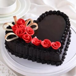 Luxury heart-shaped chocolate cake with fondant roses for special occasions