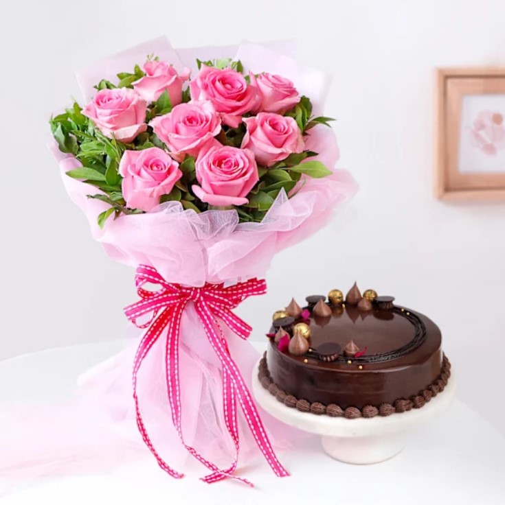 Blossom Bliss Cake Combo Elegant flower bouquet with a luscious cake, a dreamy gift for anniversaries, birthdays, and romantic surprises.
