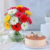 A luxurious floral arrangement paired with a delectable cake, ideal for gifting and making special occasions even more memorable.