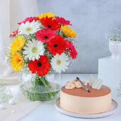 A luxurious floral arrangement paired with a delectable cake, ideal for gifting and making special occasions even more memorable.