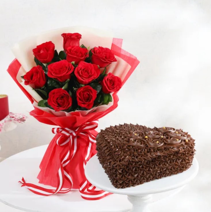 Heavenly Floral Symphony Cake Heart-shaped truffle cake with ruby red accents, ideal for Valentine's Day, anniversaries, and romantic surprises.
