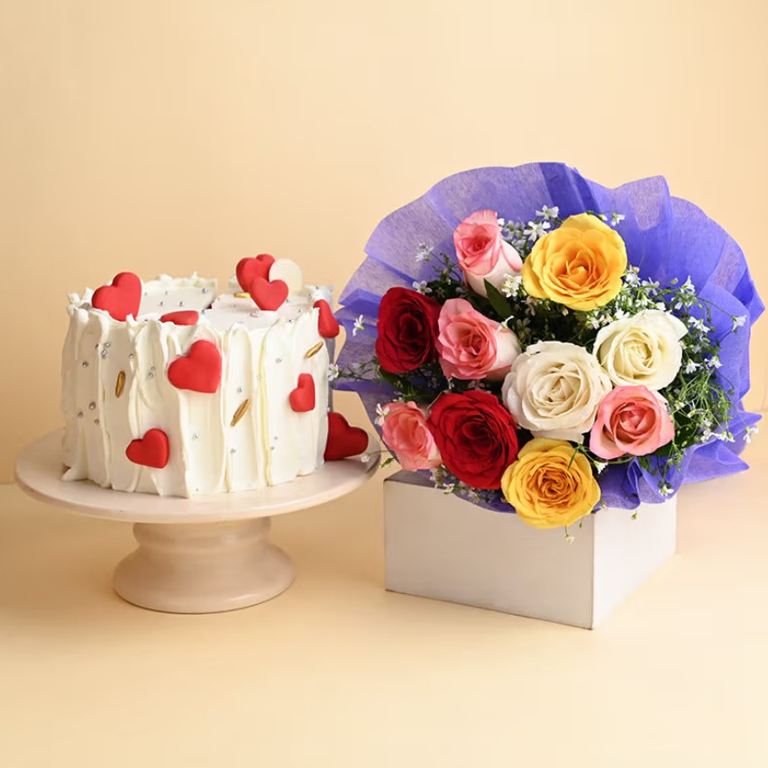Love Cake And Flower Combo Beautiful heart-shaped cake with a bouquet of mixed roses – the perfect romantic gift for anniversaries, birthdays, and special celebrations.