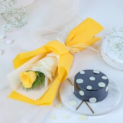 Yellow Rose & Truffle Combo featuring a vibrant bouquet of yellow roses and a decadent truffle cake, perfect for special celebrations.