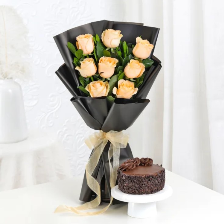 Roses Bouquet With Mini Cake Beautiful red roses paired with a decadent chocolate treat, creating the perfect indulgence for special occasions and romantic surprises.