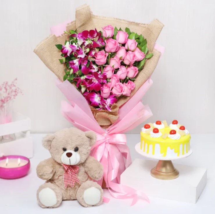 Sweet Love Delight Hamper Elegant Roses & Orchids with a delectable pineapple cake, perfect for celebrations, gifting, and making special moments unforgettable.