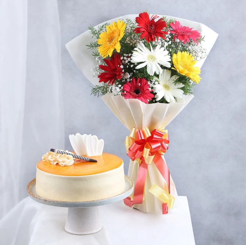 Vibrant Gerbera & Butterscotch Cake Delicious butterscotch cake paired with a stunning gerbera flower bouquet, perfect for birthdays, anniversaries, and heartfelt surprises.